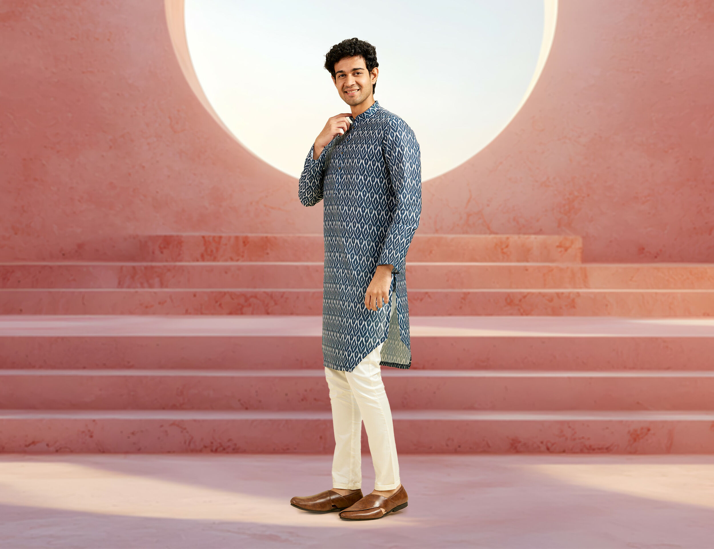 A Man in a casual printed kurta and contrast pajamas